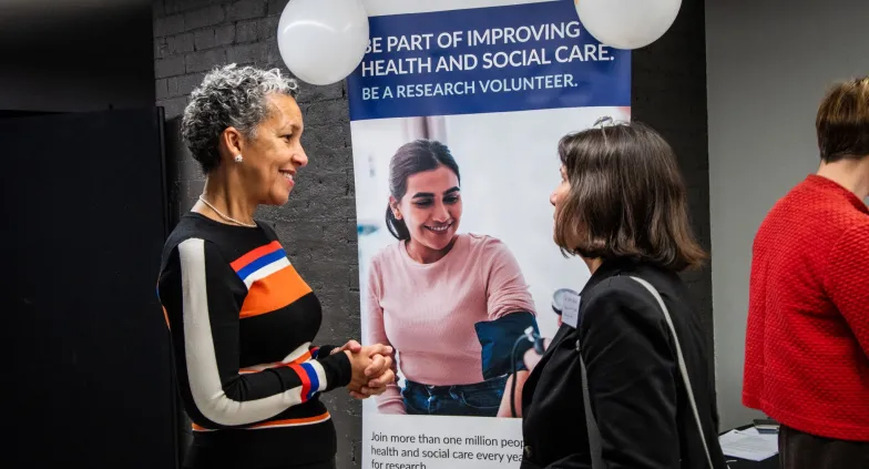 Professor Avan Aihie Sayer networking at the launch event