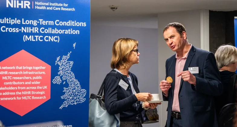 Attendees networking at the launch event